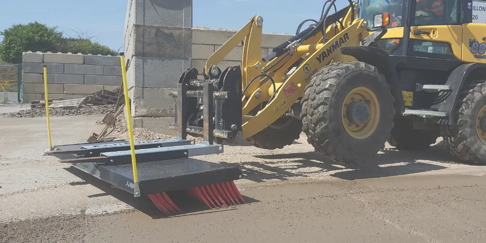 ActiSweep tractor-mounted push broom moving loose bulky material