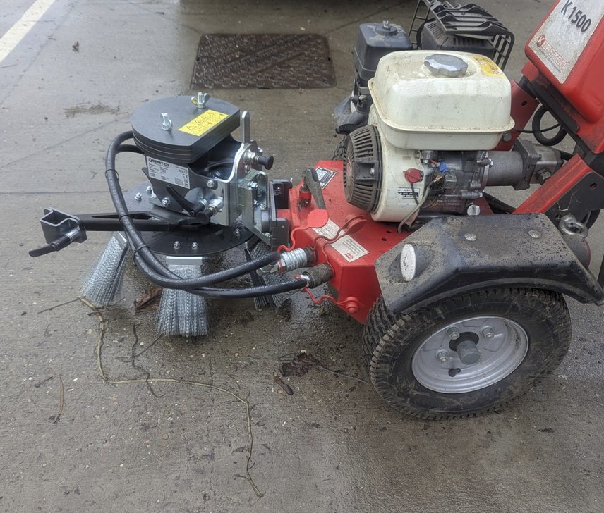 Weedbrush removes weeds and moss from paving