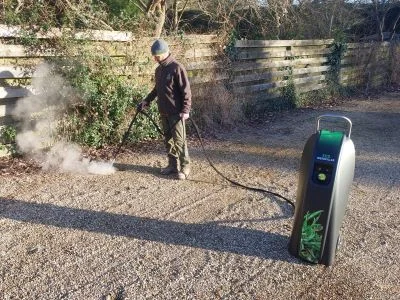 Eco Weedkiller applying hot water to unwanted vegetation